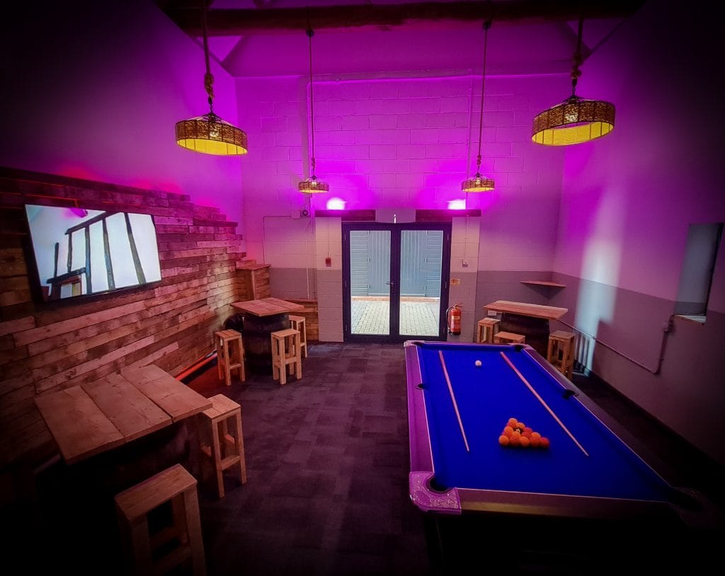 entertainment room with led lights, pool table and tv at a function room near bristol