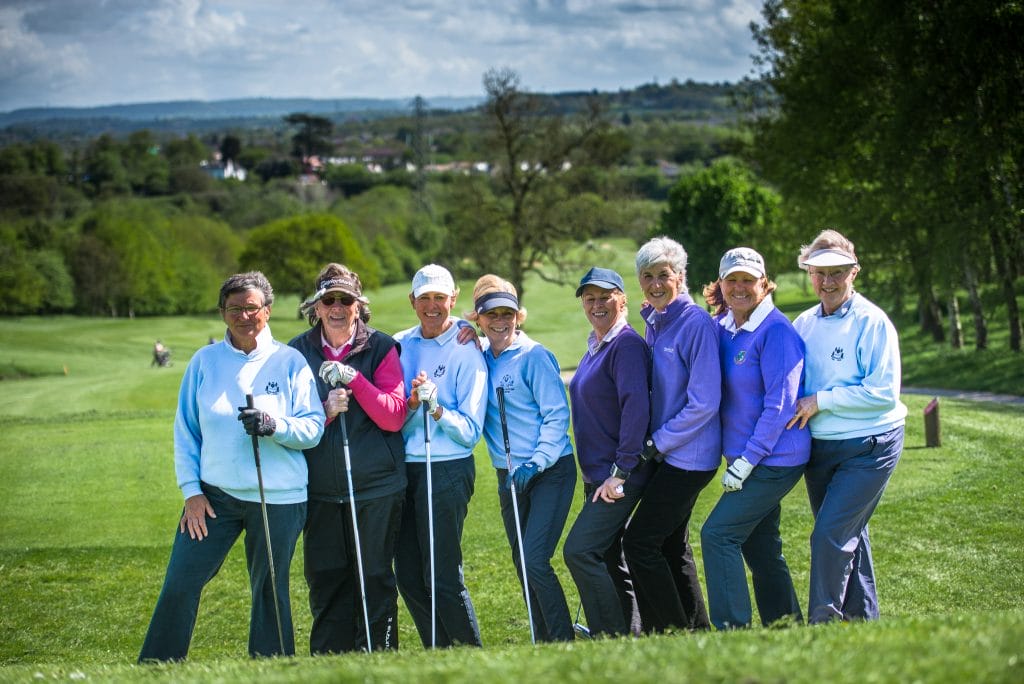 group of people on golf course at a group golf day in bristol