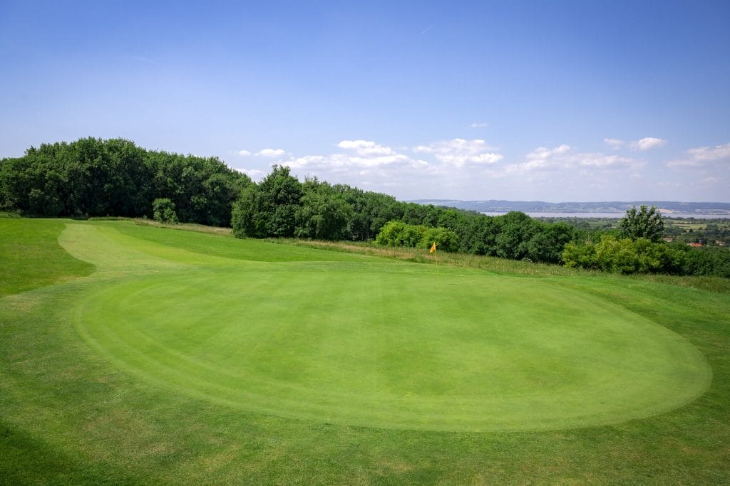 immaculate green at golf course in bristol