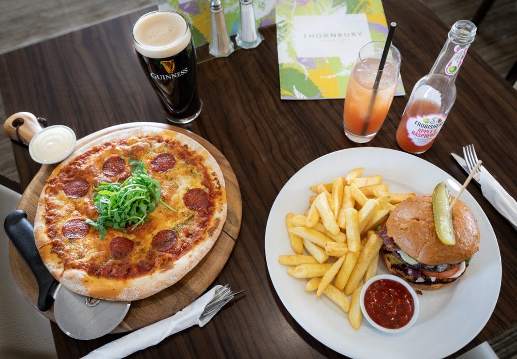 Delicious pizza and burger served at a popular restaurant near Alveston, offering tasty food near Bristol