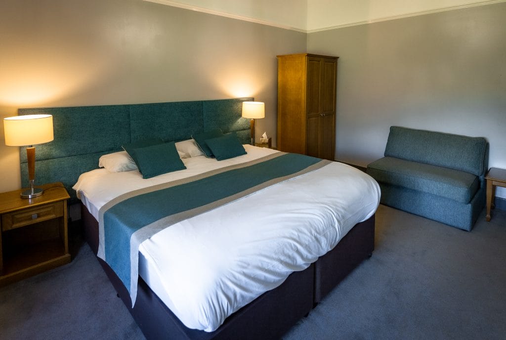 cosy hotel room with large hypnos bed at hotel in bristol