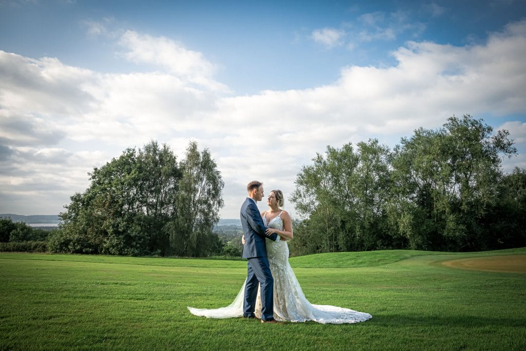 Just married couple enjoying a quiet moment outdoors at Thornbury Golf and Lodge, a beautiful location for weddings near Bristol