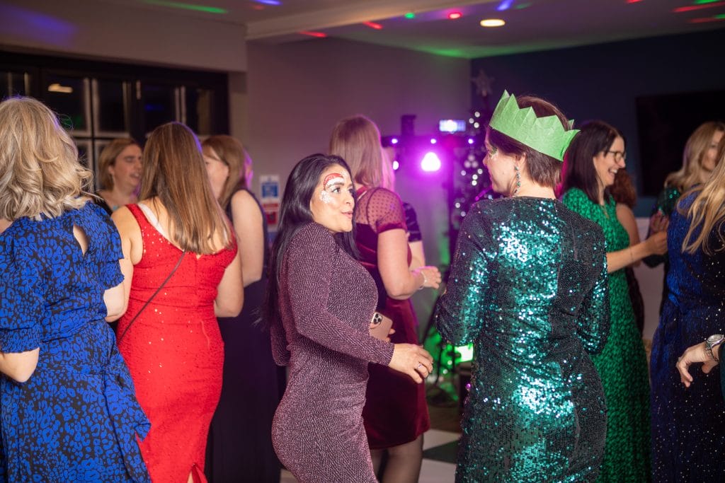group of women dancing at disco at a christmas party in bristol