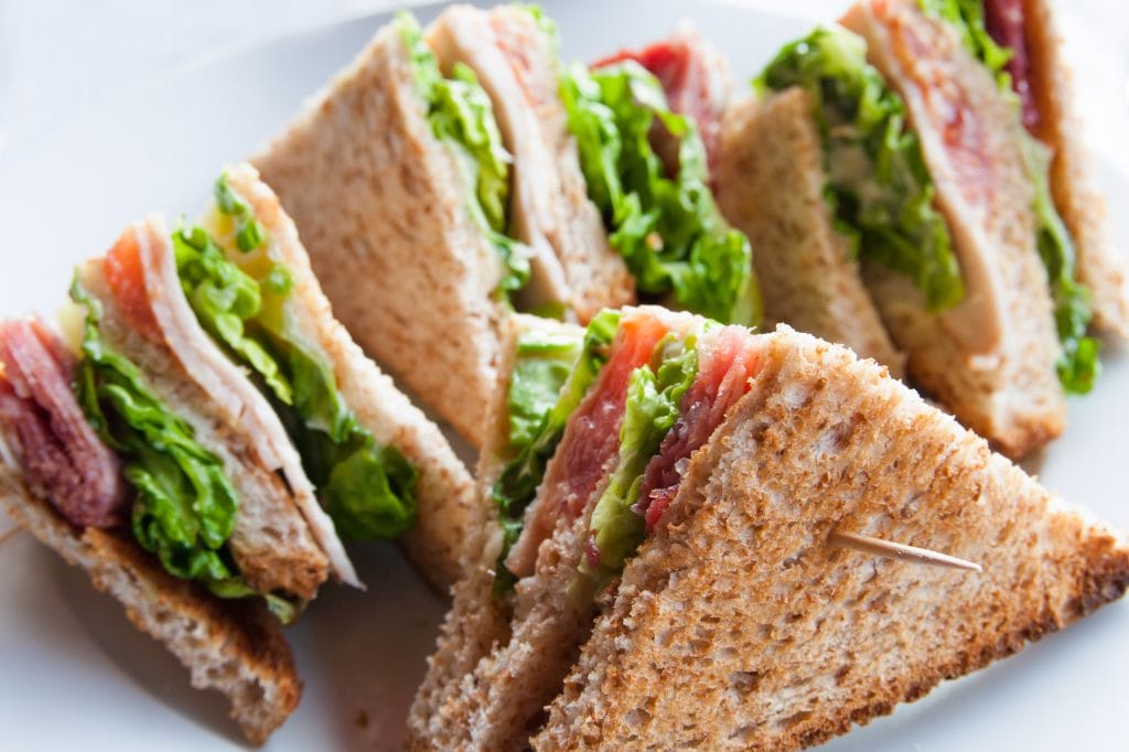 fresh salad leaves in sandwich with skewers