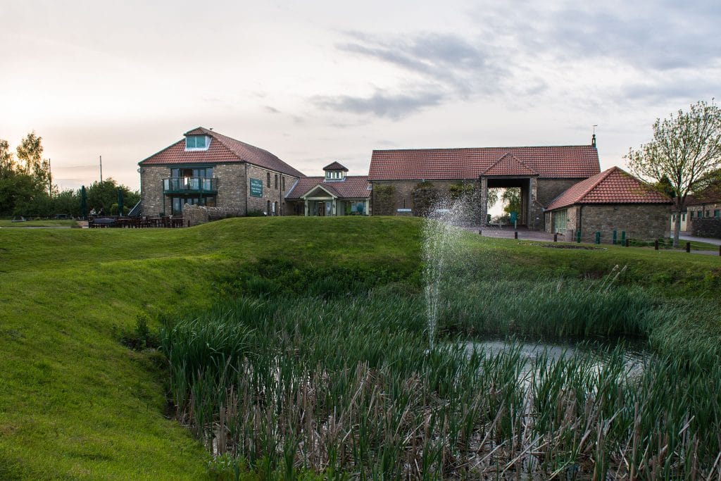 water fountain on golf course in bristol overlooking the clubhouse