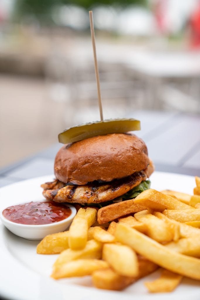 Tender chicken burger with lettuce and sauce served at a local restaurant in Bristol, ideal for lunch or dinner near Alveston.
